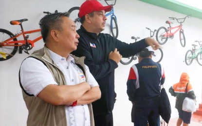 <p><strong>TOP EXECS.</strong> PhilCycling president Abraham Tolentino (left) and Philippine Sports Commission chair Richard Bachmann watch the final day of the Asian BMX Championships for Freestyle and Racing at Tagaytay City BMX Park on Sunday (July 16, 2023). PhilCycling wants to host the Asian Championships and the UCI World Cup in 2025. <em>(PhilCycling photo)</em></p>