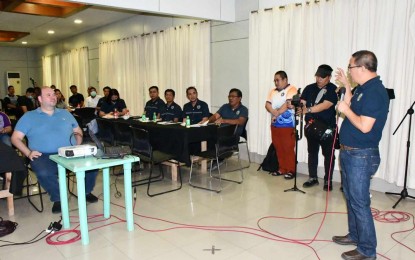 <p><strong>DISASTER RESILIENCE.</strong> Negros Oriental Gov. Manuel Sagarbarria (seated, left) listens to Adrian Sedillo, Provincial Disaster Risk Reduction and Management Office chief, during Monday's (July 17, 2023) opening of a five-day seminar workshop on the Public Service Continuity Plan. The seminar aims to ensure the continuity of regular operations and transactions even during disasters and other emergencies. <em>(Photo courtesy of PDRRMO)</em></p>