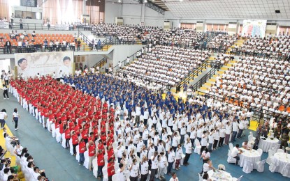 <p><strong>DEBT FREE</strong>. Over 2,500 farmer-beneficiaries from Negros Occidental receive their land titles in a ceremony held in Cadiz City to mark the signing of the New Agrarian Emancipation Act by President Ferdinand R. Marcos on July 7, 2023. The new law stands to benefit around 170,096 from Western Visayas. (Photo by DAR-Western Visayas Facebook)</p>