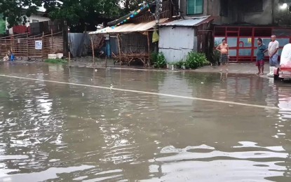 <p><strong>FLOOD</strong>. Flooding is experienced in Iloilo City’s East Timawa village on Monday (July 17, 2023). Mayor Jerry P. Treñas, in a press conference, said that they continue to monitor the weather situation and make the necessary announcements when needed. <em>(Photo courtesy of Iloilo City Disaster Risk Reduction and Management Office)</em></p>