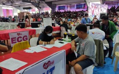 <p><strong>‘LAB FOR ALL’.</strong> Residents in Zambales avail of free medical consultations and other health services during the launch of the "Lab For All" caravan held at the Botolan People's Plaza on Tuesday (July 18, 2023). The project was initiated by First Lady Marie Louise Araneta-Marcos in an effort to bring free medical consultations, laboratory services, and distribution of medicines to residents. <em>(Photo courtesy of DOH-Central Luzon)</em></p>