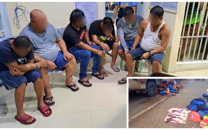 <p><strong>ROBBERY GANG.</strong> Six robbery suspects evade questions from reporters after their arrest in Kidapawan City, North Cotabato on Tuesday afternoon (July 18, 2023). The suspects allegedly robbed at gunpoint a delivery truck earlier on the same day in adjacent Makilala town and fled towards Kidapawan where they were cornered (inset) by pursuing police units.<em> (Photo by John Andrew Tabugoc)</em></p>