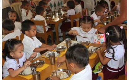 <p><strong>FEEDING PROGRAM</strong>. The Department of Social Welfare and Development holds Supplemental Feeding Program for school children in this undated photo. A total of four million children benefited from the program since it started in 2021. <em>(Photo from DSWD)</em></p>