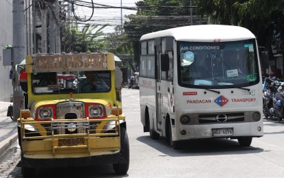 <p><strong>JEEPNEYS.</strong> A traditional jeepney and a modern jeepney along Pedro Gil St., Malate, Manila on July 20, 2023. Land Transportation Franchising and Regulatory Board chair Teofilo Guadiz III on Tuesday (Jan. 9, 2024) said transport cooperatives or corporations must decide themselves which models and where to buy their modern jeepneys following criticisms that modern jeepneys were imported instead of locally manufactured.<em> (PNA photo by Yancy Lim)</em></p>