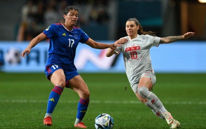 <p><strong>GALLANT EFFORT.</strong> The Philippines' Alicia Barker (left) tries to keep the ball in play against Switzerland in the Filipinas' FIFA Women's World Cup debut at Forsyth Barr Stadium in Dunedin on Friday (July 21, 2023). Switzerland won, 2-0. <em>(Courtesy of FIFA World Cup Facebook)</em></p>