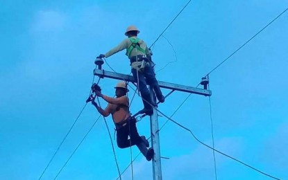 <p><strong>POWER RESTORATION</strong>. Linemen of Northern Negros Electric Cooperative (Noneco) work on the restoration of the power supply after an electric pole was toppled earlier this week. On Friday (July 21, 2023), Noneco, along with the two other distribution utilities in Negros Occidental, reported a decrease in power rate for July mainly due to lower generation charges. <em>(Photo courtesy of NONECO Facebook Page)</em></p>