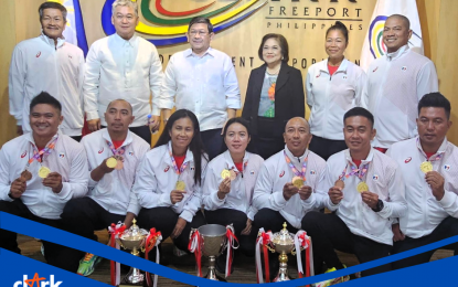 <p><strong>MEDALISTS.</strong> A group photo of Philippine lawn bowls team members who won medals at the 14th Asian Championships in Ipoh, Malaysia during a courtesy call on Clark Development Corporation chair Edgardo Pamintuan and president/chief executive officer Agnes VST Devanadera (back row, third and fourth from left) last March. The team will join the World Championships scheduled on Aug. 29 to Sept. 10, 2023 in Queensland, Australia. <em>(CDC photo)</em></p>