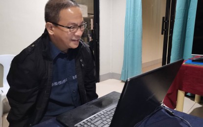 <p><strong>WEATHER WATCH.</strong> Adrian Sedillo, executive director of the Negros Oriental Provincial Disaster Risk Reduction and Management Office, update counterparts at the regional level in a virtual meeting on Monday (July 24, 2023). The PDRRMO is keeping watch over a projected heavy rainfall in the province over the next two days that could trigger floods and landslides. <em>(Photo by Judy Flores Partlow)</em></p>