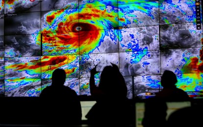 <p><strong>TYPHOON MONITORING.</strong> Atmospheric scientists of the weather bureau PAGASA monitor the track of Typhoon Egay, in their headquarters in Quezon City on Tuesday (July 25, 2023). Many areas in Luzon will continue to experience strong winds due to the typhoon. <em>(PNA photo by Joan Bondoc)</em></p>