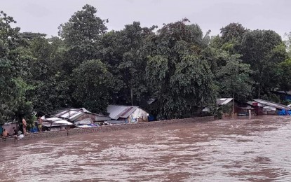 <p><strong>WATER LEVEL MONITORING</strong>. The water level rises in one of the major rivers in Bacolod City as heavy rains brought about by Super Typhoon Egay continued Tuesday (July 25, 2023). Inclement weather forced the city government of Bacolod and the provincial government of Negros Occidental to suspend work in its offices by Tuesday noon. <em>(Photo courtesy of Bacolod City DRRMO)</em></p>