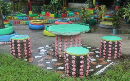 <p><strong>RECYCLED.</strong> Bottles and other plastic wastes are made into eco-brick, benches and flower pots at the Patnongon Eco-Park in Patnongon in Antique. Patnongon Municipal Environment and Natural Resources Officer Noel Salvan said in an interview Wednesday (July 26, 2023) that through his initiative, their local government unit is now regulating single-use plastic. (<em>PNA photo courtesy of MENRO Patnongon</em>)</p>