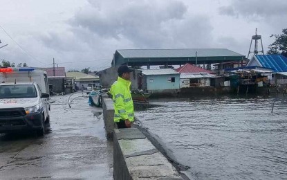 <p><strong>FLOOD MONITORING.</strong> Police personnel closely monitor the flood situation in Pilar town, Bataan province on Thursday (July 27, 2023). Some areas in Central Luzon were hit by floods due to moderate to occasionally heavy rains brought by Typhoon Egay and the enhanced southwest monsoon.<em> (Photo courtesy of Pilar PNP)</em></p>