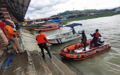<p><strong>TRAGEDY.</strong> Some PCG personnel prepare for search and rescue operations following the capsizing of MBca 'Aya Express' in the waters off Barangay Kalinawan in Binangonan town, Rizal province on Thursday (July 27, 2023). Based on the latest report of the Binangonan Municipal Disaster Risk Reduction and Management Office (MDRRMO), 40 of the boat’s 66 passengers have been rescued while 26 have died. <em>(Photo courtesy of PCG)</em></p>