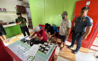 <p><strong>SEIZED DRUGS.</strong> Authorities process the PHP3.5 million worth of shabu and other evidence from two suspects during a buy-bust in Sta. Barbara, Iloilo on Saturday (July 29, 2023). The suspects, both former detainees, are currently in the custodial facility of the Philippine Drug Enforcement Agency. (<em>Photo courtesy of PDEA VI</em>)</p>