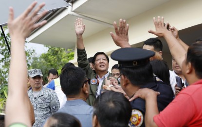 <p><strong>DAMAGE INSPECTION.</strong> President Ferdinand Marcos Jr. waves to Cagayan villagers upon his arrival at the provincial capitol in Tuguegarao City for a post-typhoon briefing after conducting an aerial inspection on Saturday (July 29, 2023). Marcos vowed immediate help for more than 28,000 families affected by Super Typhoon Egay in the Cagayan Valley Region. <em>(PNA photo by Alfred Frias)</em></p>