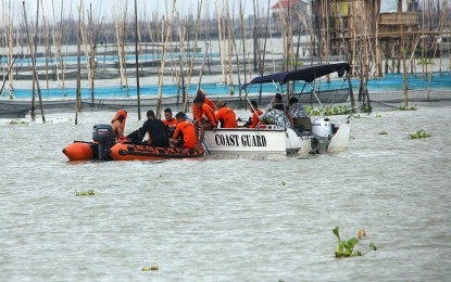 <p style="text-align: left;"><strong>SEARCH FOR VICTIMS.</strong> Philippine Coast Guard personnel search for possible missing passengers of M/B Aya Express at the Laguna Lake on July 28. Senator Grace Poe on Monday (July 31, 2023) filed a resolution seeking to determine accountability for the July 27 tragedy and to find out whether maritime regulations have been followed. <em>(PNA photo by Joan Bondoc)</em></p>
