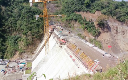 <p><strong>JALAUR PROJECT</strong>. The construction of the high dam, one of the three dams of the Jalaur River Multipurpose Project Stage II (JRMP II) in the town of Calinog, Iloilo has already reached 99 meters as of July. The JRMP II project needs an additional PHP8.48 billion in funds for its completion. <em>(PNA file photo by PGLena)</em></p>