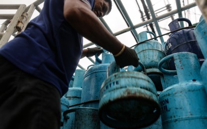 <p><strong>RISING PRICES</strong>. Liquefied petroleum gas (LPG) cylinders get unloaded from a truck at a retail store along Kamias Road in Quezon City on Tuesday (Aug. 1, 2023). Oil companies increased the prices of LPG after three straight weeks of price hikes for gasoline, and the fourth for both diesel and kerosene. The latest adjustments come after firms rolled back LPG prices for the months of June and July. <em>(PNA photo by Joan Bondoc)</em></p>