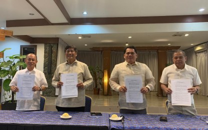 <p><strong>TRANSITION AGREEMENTS.</strong> National Commission of Senior Citizens (NCSC) officials led by Chairperson Franklin M. Quijano (second left) and Commissioner Edwin G. Espejo (extreme right), and Department of Social Welfare and Development (DSWD) Regional Directors Ramel F. Jamen (extreme left) of Region 10 and Loreto V. Cabaya Jr. (second right) of Region 12 present the signed memorandums of agreement on transition following the signing ceremony in Cagayan de Oro City on Monday afternoon (July 31, 2023). The agreements involve the free use of office space for the NCSC at the DSWD Regional Offices 10 and 12 and for data sharing and management. <em>(Photo courtesy of Allen V. Estabillo)</em></p>