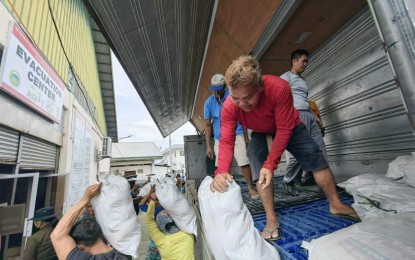 <p><strong>RELIEF EFFORTS</strong>. Food packs are being unloaded for distribution to flood-hit villagers in Pampanga in this undated photo. Relief efforts were stepped up to provide the immediate needs of residents in Central Luzon who were badly affected by the onslaught of Typhoon Egay and the enhanced southwest monsoon. <em>(Photo courtesy of the Provincial Government of Pampanga)</em></p>