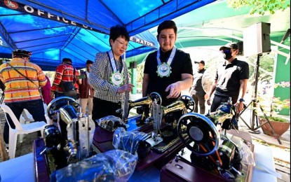 <p><strong>SEWING MACHINES.</strong> People’s Republic of China–Davao Consul General Zhao Xiuzhe (left) and Rodrigo “Rigo” Duterte II inspect the sewing machines to be given to the indigenous people (IP) in Davao City on Wednesday afternoon (Aug. 2, 2023). At least 320 sewing machines were donated by the China government through the Office of (1st District) Rep. Paolo Duterte to the city’s IP residents.<em> (Photo courtesy of Rep. Paolo Duterte's office)</em></p>