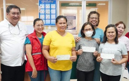 <p><strong>LIVELIHOOD AID</strong>. Representatives of the micro-enterprises in Bacolod City which received livelihood assistance from the Department of Social Welfare and Development through the Sustainable Livelihood Program, with Councilor Jude Thaddeus Sayson (left) and City Department of Social Services and Development head Sally Abelarde (3rd from right), earlier this week. The three associations were granted a total of PHP1.245 million for various projects. <em>(Photo courtesy of Bacolod City PIO)</em></p>