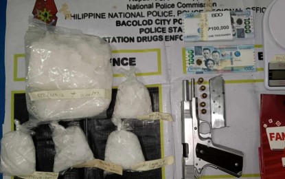 <p><strong>GUN AND DRUGS</strong>. Anti-drug operatives of Bacolod City Police Office Station 8 seize 1.3 kilos of shabu worth PHP8.84 million and a caliber .45 pistol during a buy-bust at a residence in Barangay Singcang-Airport, Bacolod City Thursday night (Aug. 3, 2023). Three drug personalities, tagged as high-value individuals, were arrested during the operation.<em> (Photo courtesy of Bacolod City Police Office)</em></p>