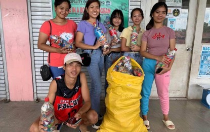 <p><strong>GARBAGE FOR RICE</strong>. Students of the Antique Vocational School in Bugasong, Antique show their collected residual waste they will exchange with rice from the local government unit of Bugasong under the "Garbage in a Bottle" initiative on Feb. 7, 2023. Domingo Lavega, the farm foreman under the Municipal Environment and Natural Resources Office (MENRO), said in an interview Friday (August 4, 2023), the initiative they introduced two years ago has helped reduce their solid waste. (<em>PNA photo courtesy of MENRO Bugasong</em>)</p>
<p> </p>
<p> </p>