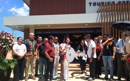 <p><strong>REST AREA.</strong> Tourism Secretary Christina Frasco (center) hands over the symbolic key to Bukidnon Gov. Rogelio Neil Roque (center, right) during Friday's (Aug. 4, 2023) opening of the Tourism Rest Area (TRA) in Manolo Fortich town. The facility, the first-ever in Mindanao, cost PHP7 million<em>. (PNA photo by Ercel Maandig)</em></p>