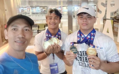 <p><strong>TOP ATHLETES.</strong> Western Visayas trackster Mico Villaran (center) bagged four gold medals and one silver while Airex Gabriel Villanueva pocketed a gold medal each in shot put and discus throw in the 2023 Palarong Pambansa which ends Saturday (Aug. 5, 2023) in Marikina City. Coached by Miguel Arca (left), Villaran emerged the most bemedaled athlete in the secondary boys' division while Villanueva broke a five-year record in discus throw.<em> (Photo courtesy of Miguel Arca)</em></p>