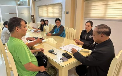 <p><strong>STATE OF CALAMITY.</strong> Lingayen Mayor Leopoldo Bataoil (right) meet with other local government officials on Friday (Aug. 4, 2023). The local government declared a state of calamity after Lingayen’s 32 barangays have been affected by the onslaught of Super Typhoon Egay and Typhoon Falcon, and the southwest monsoon. <em>(Photo courtesy Mayor Leopoldo Bataoil)</em></p>