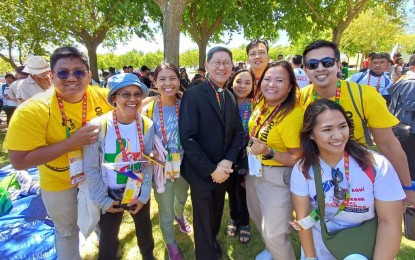 <p><strong>PH DELEGATION.</strong> Cardinal Luis Antonio Tagle (center) mingles with Filipinos at the 2023 World Youth Day in Lisbon, Portugal in this undated photo. He urged the youth to be influencers of Jesus Christ on social media by spreading truth, justice and the gospel. <em>(CBCP News photo)</em></p>