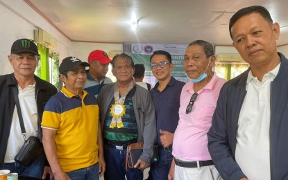 <p><strong>PEACE PACT.</strong> Members of the Moro Islamic Liberation Front (MILF) locked in a long-standing family feud agreed to end violence after 10 years, as they pose with MILF Eastern Mindanao Front commander Jack Abas (center with corsage) in Sultan Kudarat, Maguindanao del Norte on Sunday (Aug. 6, 2023).  Abas, the former chief of the MILF Eastern Mindanao Front, is a current member of the Bangsamoro parliament. <em>(Photo courtesy of MP Jack Abas)</em></p>