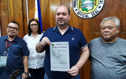 <p><strong>IMPROVING HEALTH SERVICES.</strong> Negros Oriental Governor Manuel Sagarbarria presents the License to Operate document designating the Negros Oriental Provincial Hospital as a Level 2 facility on Tuesday (Aug. 8, 2023). In the photo are (L-R) Dr. Marc Anthony Llosa, NOPH chief; Dr. Liland Estacion, provincial health officer; and Dr. Jaime Bernadas, the Department of Health director in Region 7.<em> (Photo by Judy Flores Partlow)</em></p>