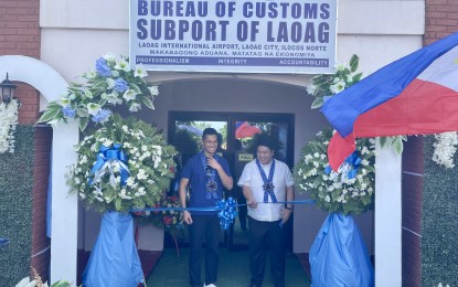 <p><strong>NOW OPEN</strong>. Bureau of Customs Commissioner Bienvenido Rubio (right) and Ilocos Norte Governor Matthew Joseph Manotoc lead the ribbon-cutting ceremony for the new BOC sub-port office in Laoag City on Tuesday (Aug. 8, 2023). The new office is located across the Laoag International Airport. <em>(PNA photo by Leilanie G. Adriano)</em></p>