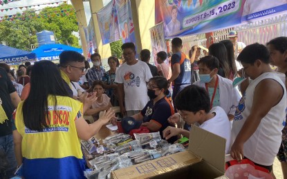 <p><strong>HEALTH CARE SERVICES.</strong> House Committee on Ethics and Privileges vice chair, Ako Bicol Party-list Rep. Raul Angelo Bongalon, talks with beneficiaries of a medical-dental mission in Guinobatan town, Albay province on Wednesday (Aug. 9, 2023). Hundreds of residents and Mayon evacuees in the town benefited from the activity. <em>(PNA photo by Connie Calipay)</em></p>
