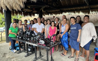 <p><strong>SEA EXPLORERS.</strong> Scuba divers from different groups in Negros Oriental province strike a pose with Vallehermoso municipal mayor Ann Serion-Gustilo on Wednesday (Aug. 9, 2023). The Negros Oriental Tourism Council has requested the scuba divers' associations to inspect and document Vallehermoso town's coral reefs prior to promoting the seascape as the next dive destination in the province. <em>(Photo courtesy of the Negros Oriental Tourism Council)</em></p>