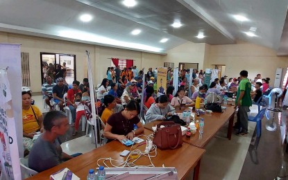 <p><strong>FINANCIAL ASSISTANCE</strong>. Eligible rice farmers receive their financial aid under the Rice Farmers Financial Assistance (RFFA) of the Department of Agriculture (DA) during the caravan payout in the Municipality of Patnongon on Wednesday (Aug. 9, 2023). Sonie Guanco, DA’s Agricultural Program Coordinating Office (APCO) officer-in-charge in Antique, in an interview, said the Aug. 7-10 caravan payout targets 9,204 small farmer-recipients in the province. (<em>PNA photo courtesy of Sonie Guanco</em>)</p>