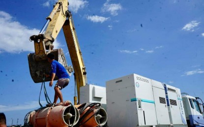 <p><strong>SUBMERSIBLE WATER PUMP</strong>. The provincial government of Pampanga tests the submersible water pump to drain some 2.8 million cubic meters of flood water accumulated at the San Fernando-Sto. Tomas-Minalin tail dike to Gugu River on Wednesday (Aug. 9, 2023). Governor Dennis Pineda said it is one of the immediate measures to ease flooding in some low-lying areas in the province. <em>(Photo courtesy of the provincial government of Pampanga)</em></p>