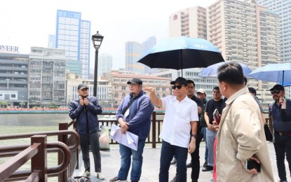 <p><strong>PASIG RIVER URBAN DEV’T.</strong> Department of Human Settlements and Urban Development Secretary Jose Rizalino Acuzar (in white polo) leads other officials in inspecting a portion of the Pasig River behind the Manila Central Post Office on Friday (Aug. 11, 2023). Acuzar was designated as chairperson of the Inter-Agency Council for the Pasig River Urban Development, which is primarily tasked by President Ferdinand R. Marcos Jr. to “facilitate and ensure the full rehabilitation of the banks along the Pasig River water system and nearby water systems.” <em>(Photo courtesy of DHSUD)</em></p>