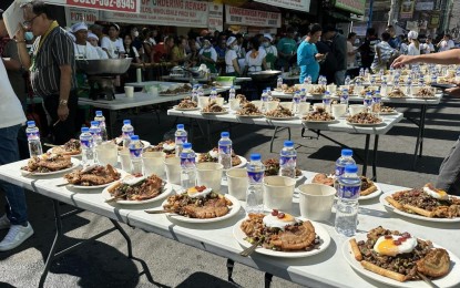 <p><strong>IBANAG DELICACY</strong>. Some 500 kilograms of miki noodles were made into pancit batil patong to highlight the Pansit Batil Fotun Festival in Tuguegarao City on Saturday (Aug. 12, 2023). Over 1,000 Tuguegaraoeños and guests partook of the famous Ibanag dish<em>. (PNA photo by Villamor Visaya Jr.)</em></p>
<p> </p>