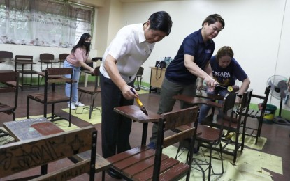 <p><strong>BRIGADA ESKWELA. </strong>President Ferdinand R. Marcos Jr. (left) and Vice President and Department of Education Secretary Sara Z. Duterte paint chairs as part of the "Brigada Eskwela" volunteer maintenance week at Victorino Mapa High School in Manila on Monday (Aug. 14, 2023). Marcos turned over PHP1 million worth of financial assistance and cleaning materials to the school. <em>(PNA photo by Rolando Mailo) </em></p>