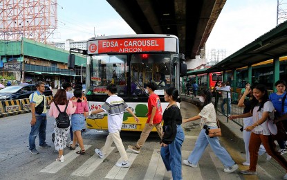 <p><strong>SAFE TRAVEL</strong>. Commuters board a bus bound for Caloocan City at the Edsa Carousel Cubao stop in Quezon City on Aug. 13, 2023.  More public utility buses have been allowed to operate starting Friday until Nov. 6 to accommodate the influx of passengers in time for Undas and the Barangay and Sangguniang Kabataan elections. <em>(PNA photo by Joan Bondoc)</em></p>