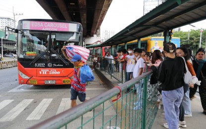 <p><strong>EDSA BUSWAY.</strong> Commuters queue up at the EDSA Cubao Station of the EDSA busway in this undated photo. Enforcers of the Special Action and Intelligence Committee for Transportation (SAICT) on Friday (April 5, 2024) apprehended an official of the Philippine National Police (PNP) as well as other unauthorized vehicles for using the exclusive bus lane.<em> (PNA photo by Joan Bondoc)</em></p>