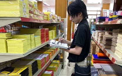 <p><strong>MONITORING</strong>. A staff of the Department of Trade and Industry-Pampanga Consumer Protection Division conducts price monitoring of school supplies in this undated photo. The DTI has also been monitoring the supply and prices of basic goods in Pampanga following the imposition of a price freeze due to the declaration of a state of calamity. <em>(Photo courtesy of DTI-Pampanga)</em></p>