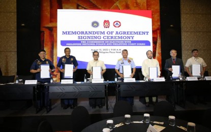 <p><strong>BSKE PREPS. </strong>Officials of the Commission on Elections, Philippine National Police and the Philippine Coast Guard sign a memorandum of agreement as part of preparations for the Barangay and Sangguniang Kabataan Elections (BSKE) at the Sofitel Philippine Plaza on Tuesday (Aug. 15, 2023). The PNP said it has monitored 27 "areas of grave concern" for the village and youth polls. <em>(Photo courtesy of Comelec)</em></p>