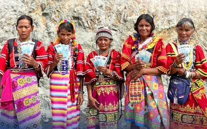 <p><strong>SOCIAL PENSION. I</strong>ndigent senior citizens in Barangay Salapawan, Paquibato District in Davao City, shows their social pension aid of PHP3,000 for the July to December 2023 period during the payout on Aug. 9, 2023. The ongoing payout started on Aug. 7 and will end on Aug. 18 targeting around 66,702 seniors in the city's three districts. <em>(Photo courtesy of DSWD-11)</em></p>