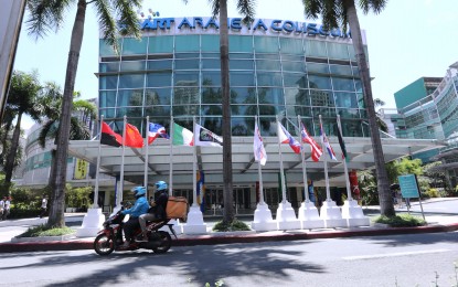 <p><strong>READY FOR ACTION.</strong> Flags of participating countries in the 2023 FIBA Basketball World Cup are lined up outside the Smart Araneta Coliseum in Cubao, Quezon City on Aug. 17, 2023. FIBA LOC Broadcast & Media Head Sienna Olaso on Tuesday (Aug. 22) said Cignal TV will be the official Philippine broadcaster of the prestigious basketball event. <em>(PNA file photo)</em></p>