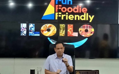 <p><strong>SLOGAN</strong>. Governor Arthur Defensor Jr. presents the “Fun, Foodie, Friendly Iloilo” tourism slogan of the province in a press conference at the provincial capitol board room on Thursday (Aug. 17, 2023). He said the slogan best represents the province.<em> (PNA photo by PGLena)</em></p>