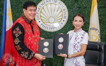 <p><strong>TOURISM DEV’T.</strong> National Commission on Indigenous Peoples (NCIP) Chair Allen Capuyan and Tourism Secretary Christina Frasco after the MOA signing at DOT Makati on Aug. 16, 2023. The DOT and the NCIP have formally partnered to boost the promotion of cultural heritage while empowering the indigenous peoples through tourism. <em>(Photo by DOT)</em></p>